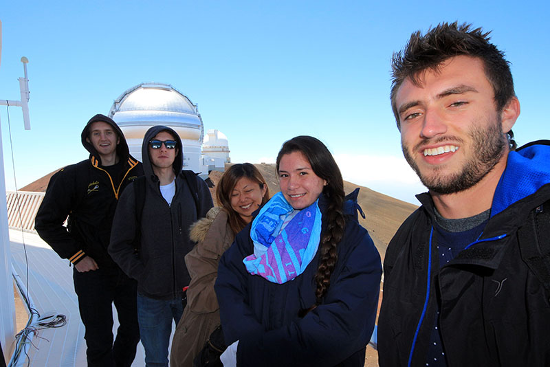 Student walking catwalk on Maunakea Observatory